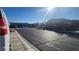 Street view displaying multiple single-story homes, desert landscaping, and paved sidewalks in a vibrant community at 864 Chianti Way, Mesquite, NV 89027