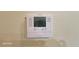 Close up of programmable thermostat on wall, features digital display at 864 Chianti Way, Mesquite, NV 89027