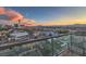 Balcony view showcases the Las Vegas skyline, framing the Stratosphere Tower and the city's vibrant landscape at sunset at 900 S Las Vegas Blvd # 1208, Las Vegas, NV 89101