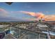 Balcony view of the Las Vegas skyline, showcasing the Stratosphere Tower and the surrounding cityscape at dusk at 900 S Las Vegas Blvd # 1208, Las Vegas, NV 89101