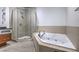 Modern bathroom with a glass-enclosed shower and a jacuzzi at 900 S Las Vegas Blvd # 1208, Las Vegas, NV 89101