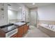 Modern bathroom featuring a soaking tub, glass shower, and vanity with a dark countertop at 900 S Las Vegas Blvd # 1208, Las Vegas, NV 89101