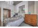 Cozy bedroom with a decorative chandelier and a dresser at 900 S Las Vegas Blvd # 1208, Las Vegas, NV 89101