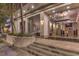 Modern building entrance with glass doors, planters, concrete steps, and a view into the lobby at 900 S Las Vegas Blvd # 1208, Las Vegas, NV 89101