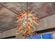 Close-up of a unique, colorful chandelier, adding an artistic flair to the home's interior at 900 S Las Vegas Blvd # 1208, Las Vegas, NV 89101