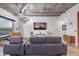 Living room with a comfortable sofa, city views, chandelier, and exposed ductwork at 900 S Las Vegas Blvd # 1208, Las Vegas, NV 89101