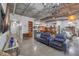 Open living space with concrete ceilings, exposed ductwork, modern lighting, and built-in shelving at 900 S Las Vegas Blvd # 1208, Las Vegas, NV 89101