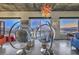 Chic living space featuring modern hanging chairs and stunning views of the city skyline at 900 S Las Vegas Blvd # 1208, Las Vegas, NV 89101