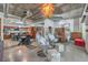 Spacious open-concept living area with modern kitchen, unique hanging chairs, and stylish decor at 900 S Las Vegas Blvd # 1208, Las Vegas, NV 89101
