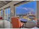 Stunning city views from expansive windows in a cozy sitting area with workspace and comfortable chair at 900 S Las Vegas Blvd # 1208, Las Vegas, NV 89101