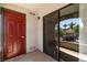 Balcony with red door and a sliding screen door offers outdoor space and community views at 950 Seven Hills Dr # 2924, Henderson, NV 89052