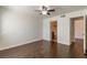 Bedroom boasts wood floors, ceiling fan, and adjacent bathroom at 950 Seven Hills Dr # 2924, Henderson, NV 89052