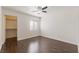 Spacious bedroom with hardwood floors, ceiling fan, window, and closet at 950 Seven Hills Dr # 2924, Henderson, NV 89052