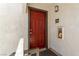 Exterior view of a red front door with unit number and stucco siding at 950 Seven Hills Dr # 2924, Henderson, NV 89052