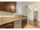 Kitchen with granite countertops, stainless steel appliances, and tile floors at 950 Seven Hills Dr # 2924, Henderson, NV 89052