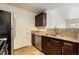 Kitchen featuring stainless steel appliances, granite countertops, and wooden cabinets at 950 Seven Hills Dr # 2924, Henderson, NV 89052