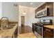 Kitchen showcases granite countertops, stainless steel appliances, and a breakfast bar at 950 Seven Hills Dr # 2924, Henderson, NV 89052