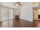 Bright living room featuring wood floors, fireplace, ceiling fan, and access to the patio at 950 Seven Hills Dr # 2924, Henderson, NV 89052