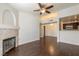 Spacious living room boasts hardwood floors, a ceiling fan, and fireplace at 950 Seven Hills Dr # 2924, Henderson, NV 89052