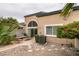 Cozy backyard featuring desert landscaping, a stone patio, and a modern-style home exterior at 10311 Birch Bluff Lane Ln, Las Vegas, NV 89145