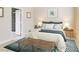 Serene bedroom featuring coastal-themed decor, a queen-sized bed, and an adjacent bathroom at 10311 Birch Bluff Lane Ln, Las Vegas, NV 89145