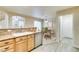 Open kitchen with granite countertops, stainless steel appliances, and eat-in dining area at 10311 Birch Bluff Lane Ln, Las Vegas, NV 89145