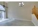 Spacious living area with high ceilings, tile floors, and sliding glass doors offering backyard view at 10311 Birch Bluff Lane Ln, Las Vegas, NV 89145