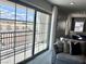 Cozy balcony view from a living room with sliding glass doors and plush throw pillows at 10376 Joaquin Fire St, Las Vegas, NV 89141