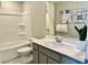Cozy bathroom featuring a bath tub, toilet and single vanity with art on the wall at 10376 Joaquin Fire St, Las Vegas, NV 89141