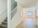 Bright entryway featuring carpeted stairs and wood-look flooring throughout at 10376 Joaquin Fire St, Las Vegas, NV 89141