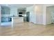 Open concept kitchen with grey cabinets, stainless steel appliances, and a center island at 10376 Joaquin Fire St, Las Vegas, NV 89141