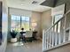 Inviting office space on a landing with desk, chair, large window and stylish decor at 10376 Joaquin Fire St, Las Vegas, NV 89141