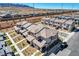 An aerial view showcases the neighborhood featuring rows of well-maintained homes and mountain views at 10773 Bede Ct, Las Vegas, NV 89166