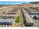 Overhead view of a desert community highlighting interconnected pathways, open spaces, townhome architecture, and desert landscaping at 10773 Bede Ct, Las Vegas, NV 89166