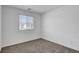 Bedroom with a window and view to the outside and neutral carpet at 10773 Bede Ct, Las Vegas, NV 89166