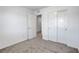 Spacious bedroom with neutral carpeting, base trim, and a large closet with sliding doors at 10773 Bede Ct, Las Vegas, NV 89166