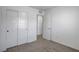 Neutral bedroom with closet, carpeted floor, white walls, and doorway at 10773 Bede Ct, Las Vegas, NV 89166