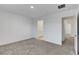 Minimalist bedroom featuring carpet, a connecting bathroom, and natural light at 10773 Bede Ct, Las Vegas, NV 89166
