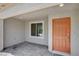 Covered front entry featuring a solid door and brick-paved porch at 10773 Bede Ct, Las Vegas, NV 89166