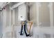 A view of the installed Rinnai water heater inside the garage at 10773 Bede Ct, Las Vegas, NV 89166