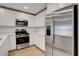 Well-appointed kitchen with stainless steel appliances and ample counter space at 10773 Bede Ct, Las Vegas, NV 89166