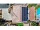 This bird's-eye perspective shows a home's roof with solar panels, patio, and landscaped yard at 11134 Casala Ct, Las Vegas, NV 89141