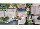 Aerial view of a backyard featuring a pool, solar panels, green landscaping and pavers at 11134 Casala Ct, Las Vegas, NV 89141