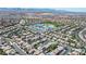 A sweeping aerial view shows a residential area near a school and a backdrop of distant mountains at 11134 Casala Ct, Las Vegas, NV 89141