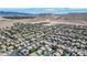 Overhead shot shows an extensive neighborhood layout against a backdrop of mountains, highlighting community living at 11134 Casala Ct, Las Vegas, NV 89141