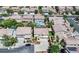 Aerial view of a community with well-maintained homes, pools, and mature trees at 11134 Casala Ct, Las Vegas, NV 89141