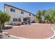 Large backyard featuring a hot tub, covered patio area, and low-maintenance desert landscaping at 11134 Casala Ct, Las Vegas, NV 89141