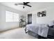 White bedroom with carpet, a ceiling fan, black accents and plenty of natural light at 11134 Casala Ct, Las Vegas, NV 89141