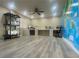 Spacious bonus room features an expansive world map wall, multiple 3D printers and light wood flooring at 11134 Casala Ct, Las Vegas, NV 89141
