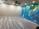 Spacious bonus room features an expansive world map wall and light wood flooring at 11134 Casala Ct, Las Vegas, NV 89141